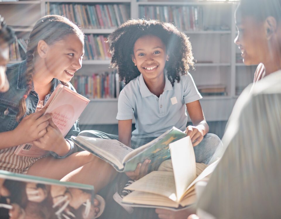 Books, storytelling or excited students reading in library for learning development or youth group growth. Smile, portrait or happy children with funny kids stories for education in school classroom.